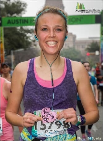 Smiling female runner at Austin Marathon finish