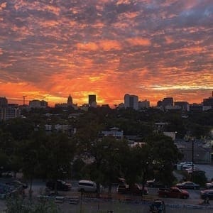 City skyline at dramatic orange sunset