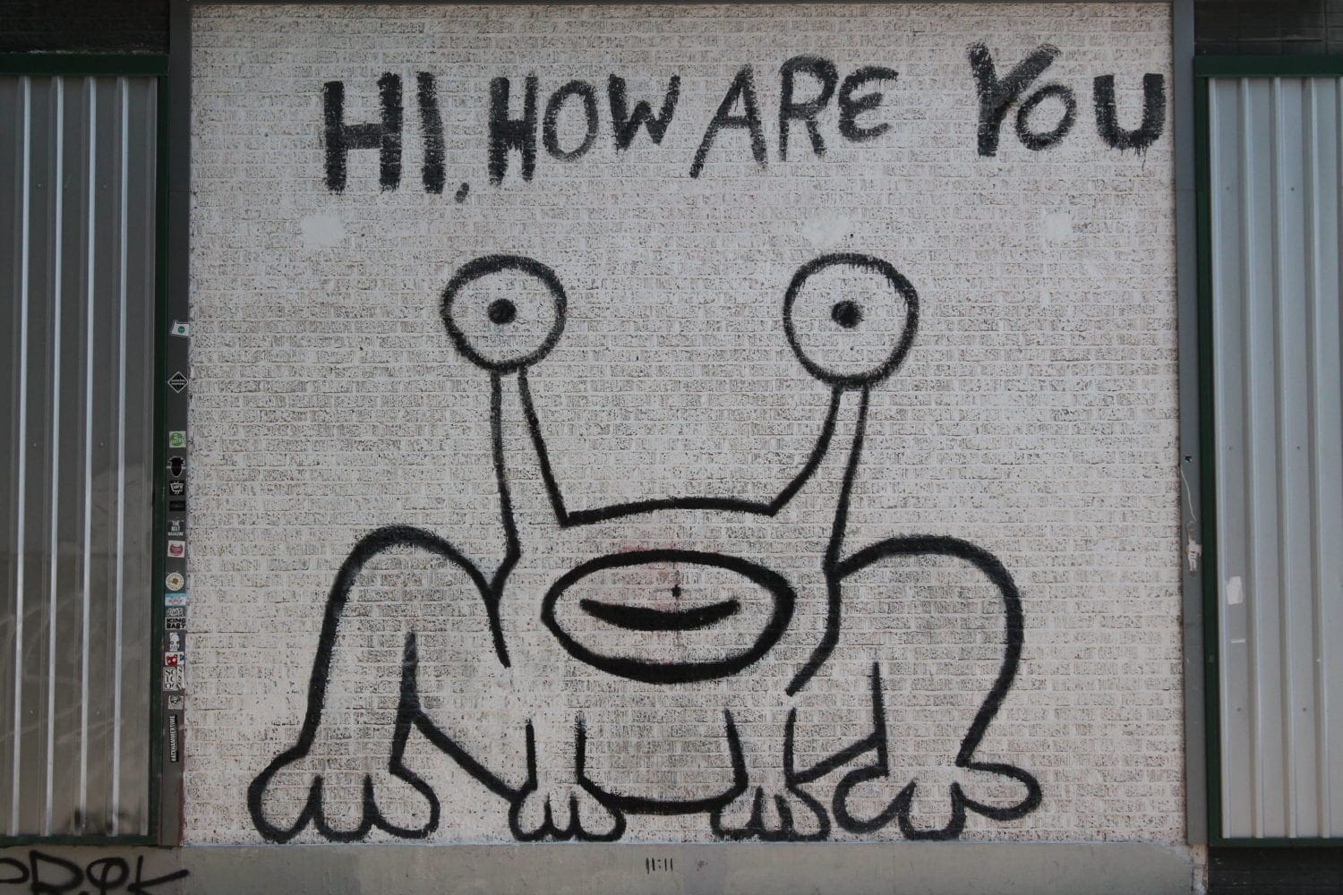 Graffiti creature with eye stalks and greeting