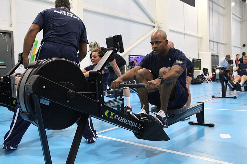 remain active Athlete rowing on Concept2 ergometer in gym