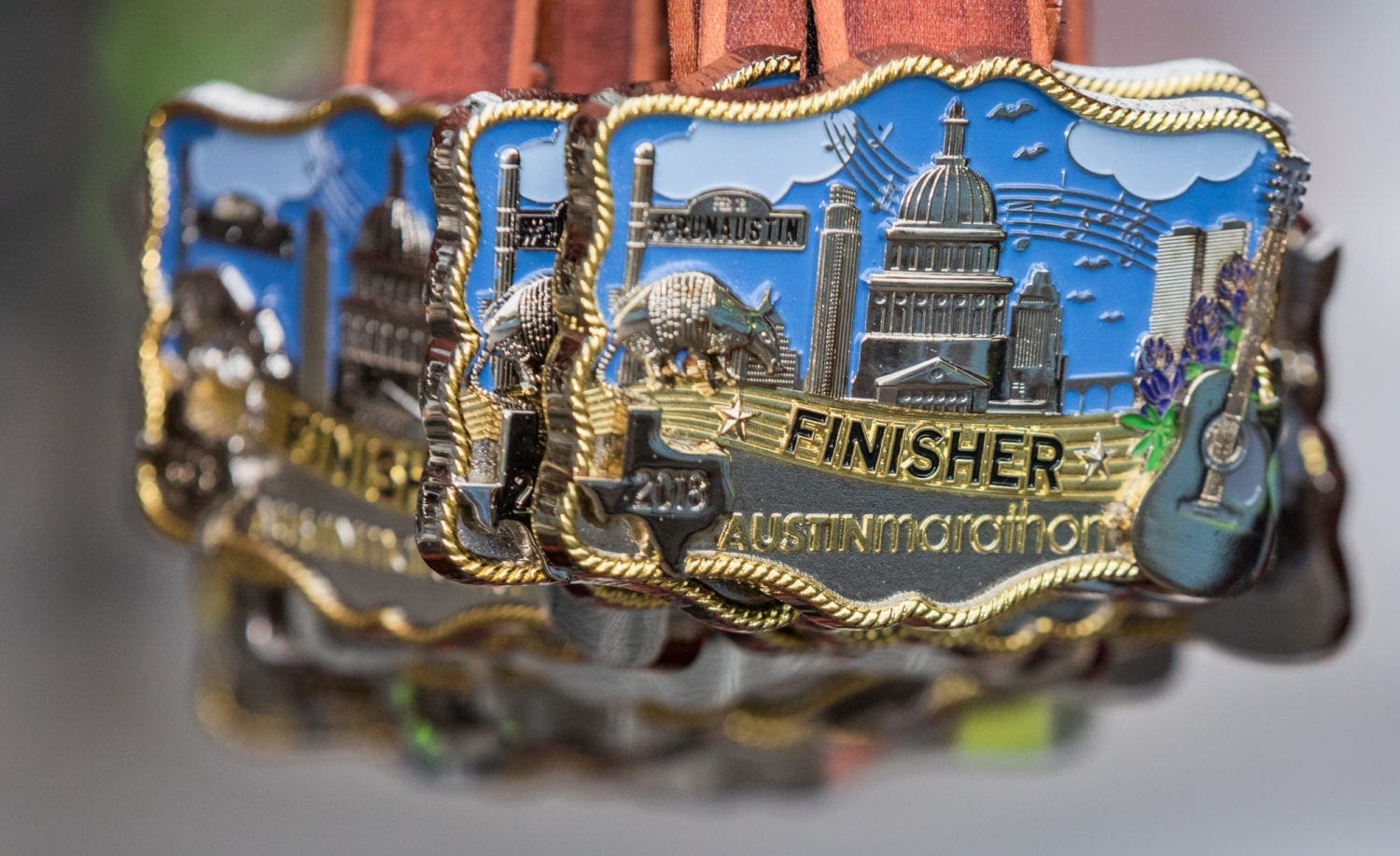 belt buckle finisher medals: perks of the 2019 Austin Marathon