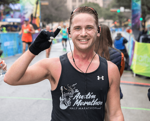Runner at Austin Marathon smiling and celebrating