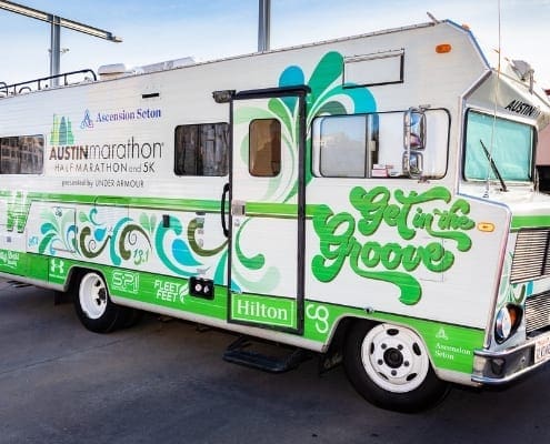 Austin Marathon promotional RV with green graphics Austin Marathon promotional RV with green graphics