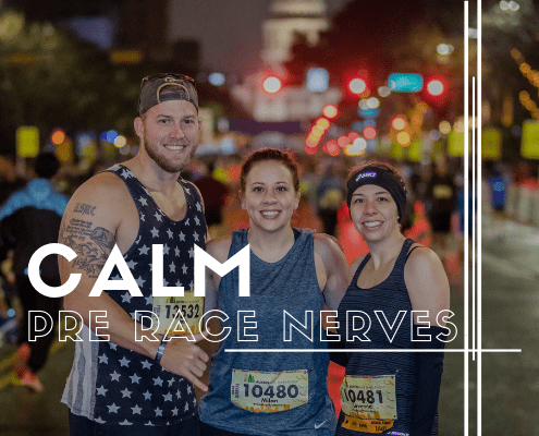 Three smiling runners before nighttime race