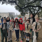 Group of Boy Scouts posing outdoors under tree Group of Boy Scouts posing outdoors under tree