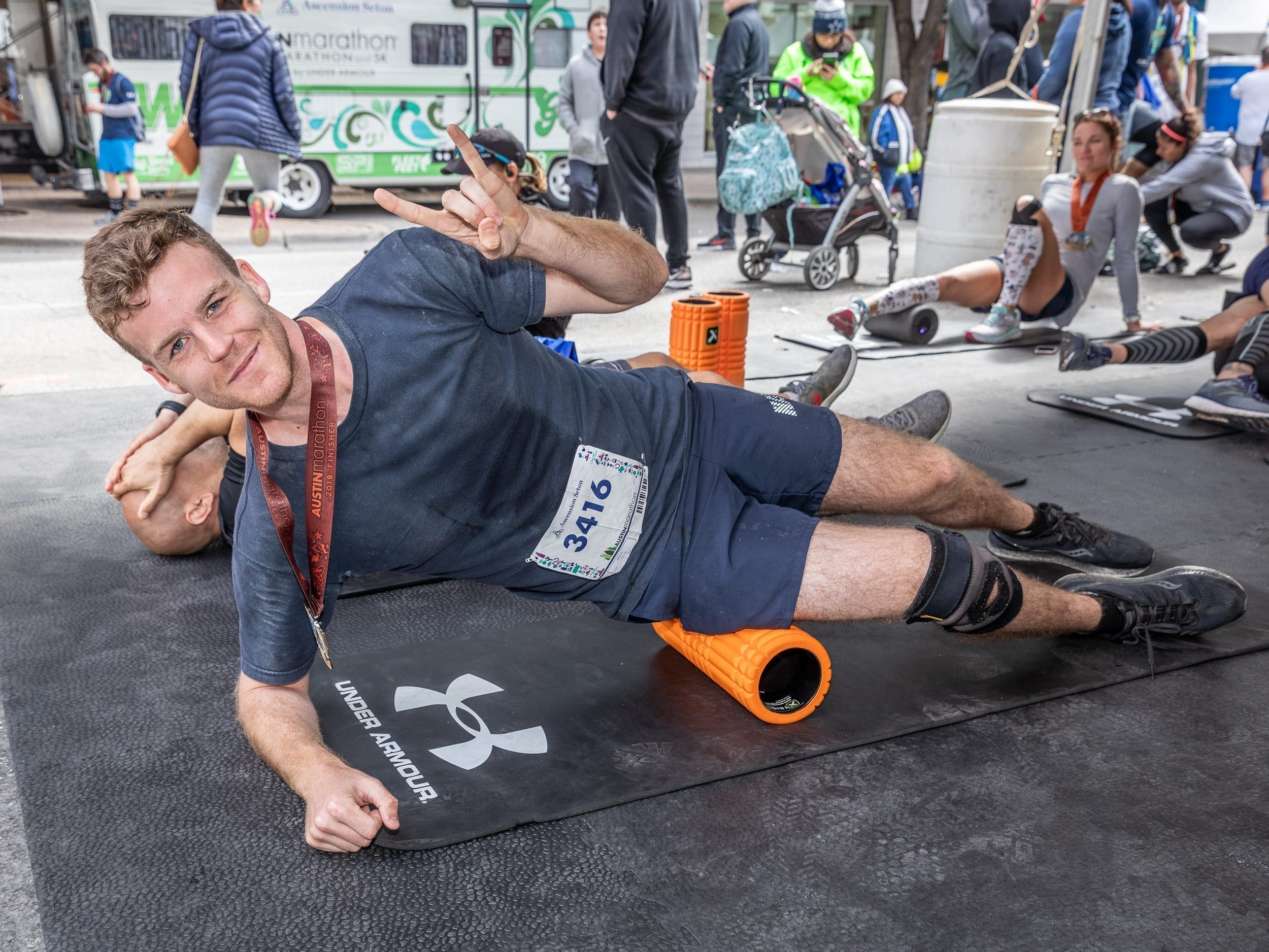 Runner foam rolls after 2019 Austin Marathon, a great tip to see improvement during training!