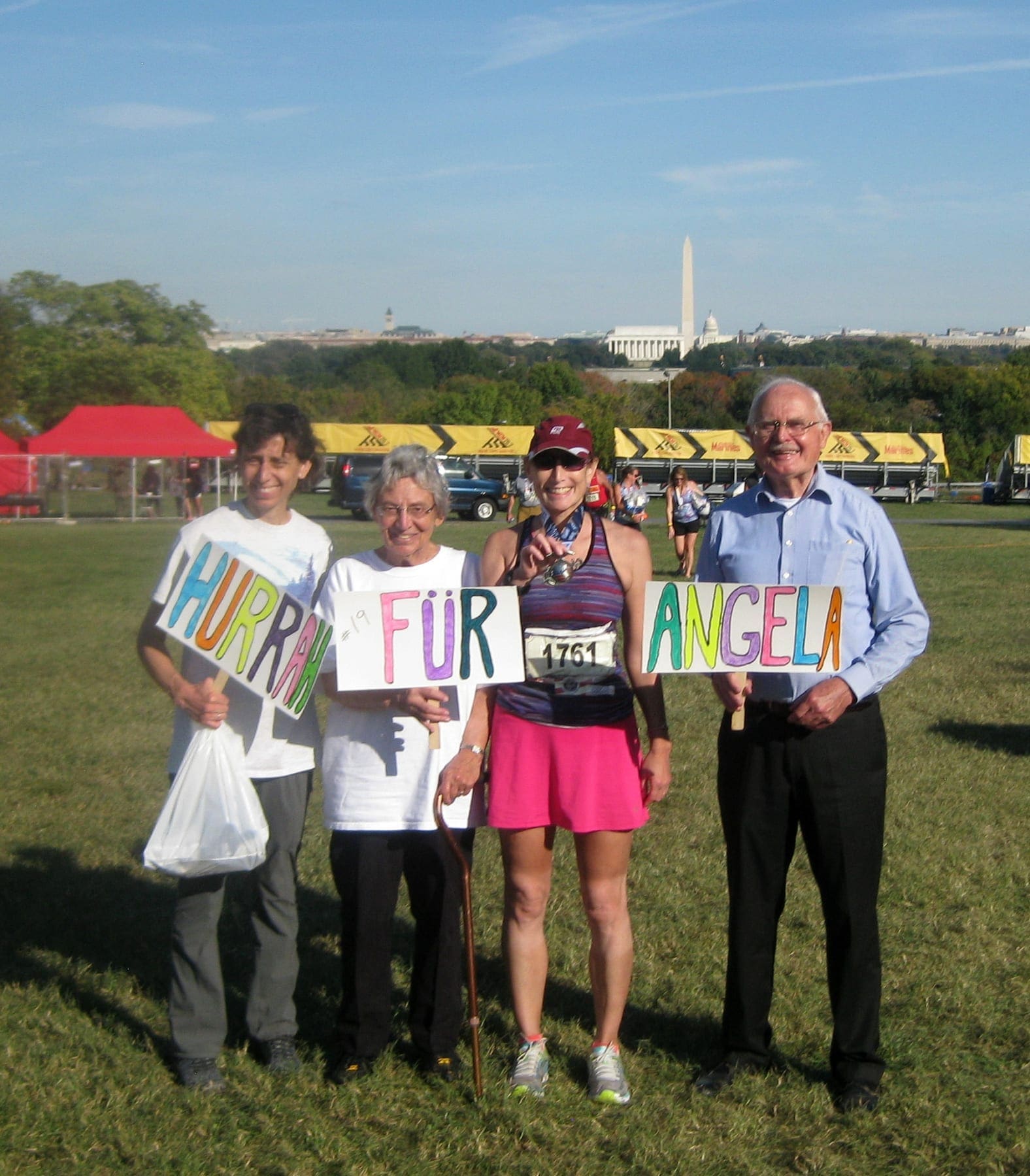 Angela Clark after crossing another marathon finish line, winning the battle against her autoimmune diseases.