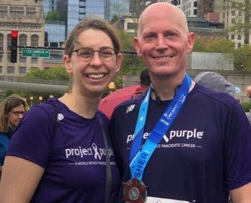 Tom and his wife, Laura, after running a race for Project Purple, a nonprofit whose mission is to find a cure for pancreatic cancer. Tom and his wife, Laura, after running a race for Project Purple, a nonprofit whose mission is to find a cure for pancreatic cancer.