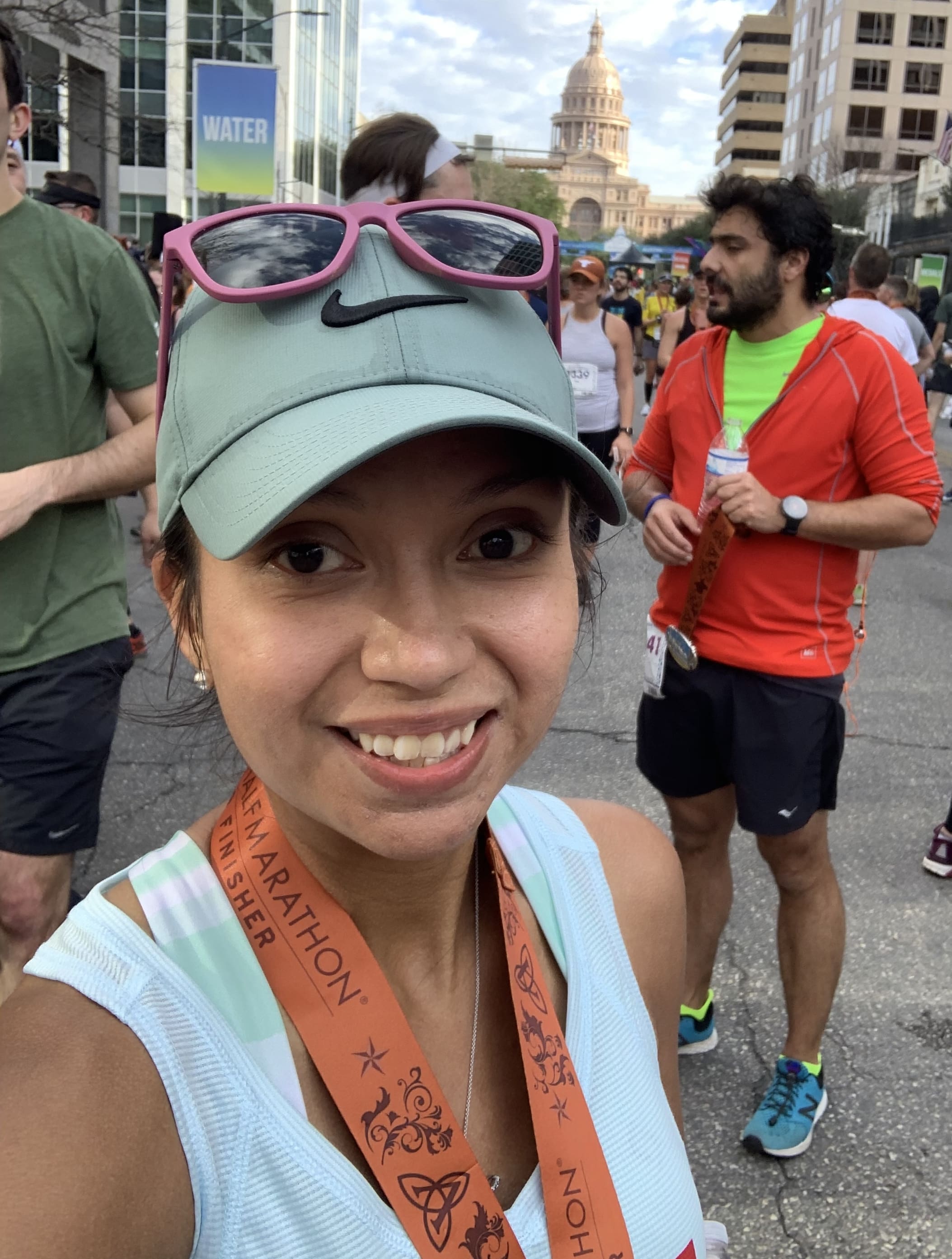 Rebecca Galvan at the 2018 Austin Half Marathon finish line, after she beat ulcerative colitis.