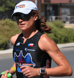 Triathlete running in black triathlon suit