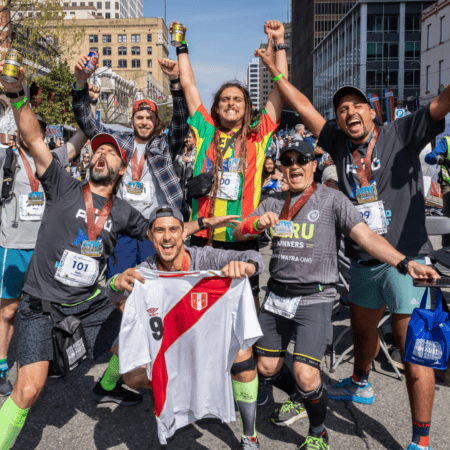 Cheerful runners holding Peruvian soccer jersey Cheerful runners holding Peruvian soccer jersey