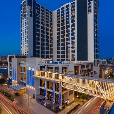 Hilton hotel high-rise with illuminated skybridge Hilton hotel high-rise with illuminated skybridge