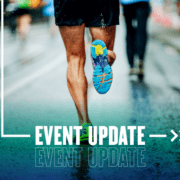 Runner’s shoe mid-stride on wet pavement Runner's shoe mid-stride on wet pavement