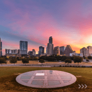 City skyline at sunset with circular plaza