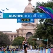 Runner approaching Austin Marathon finish by Texas Capitol
