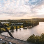 Sunset view of arched bridge over river