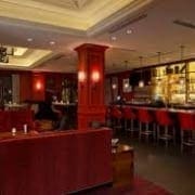 Elegant red lounge with bar and stools Elegant red lounge with bar and stools