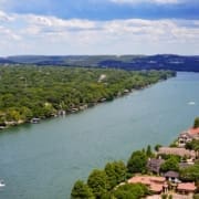 Aerial view of river with houses and boats