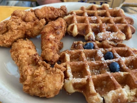 Fried chicken tenders with waffles and blueberries
