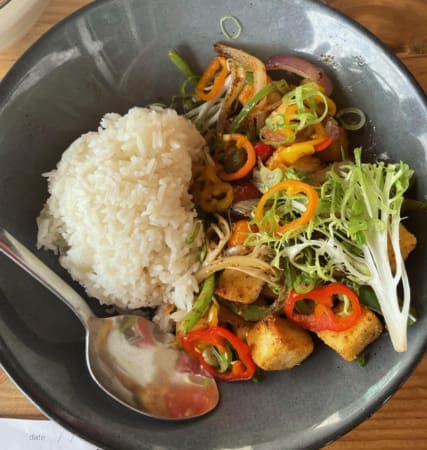 Rice bowl with tofu, peppers, and greens