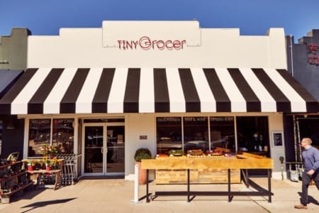 Tiny Grocer storefront with striped awning