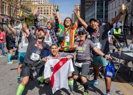 Marathon runners celebrating on city street