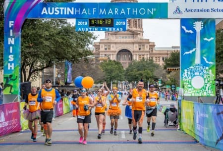 Runners crossing finish at Austin half marathon Runners crossing finish at Austin half marathon