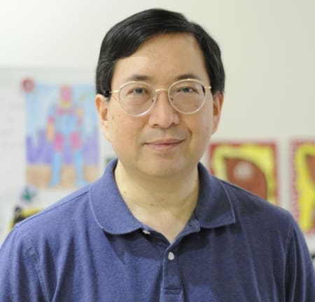 Man wearing glasses and blue polo shirt Man wearing glasses and blue polo shirt