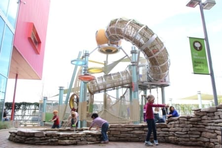 Children playing at tubular rope playground slide Children playing at tubular rope playground slide
