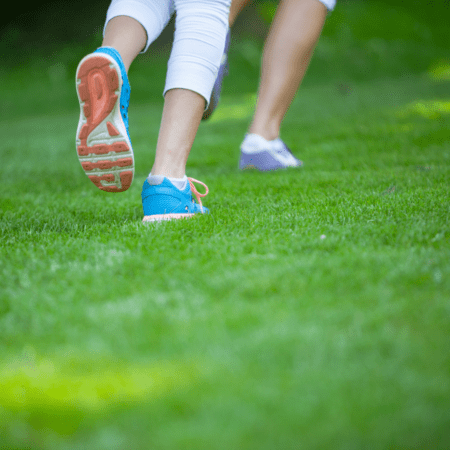 Close-up of running shoes on grass