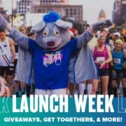 Costumed mascot cheering at race start
