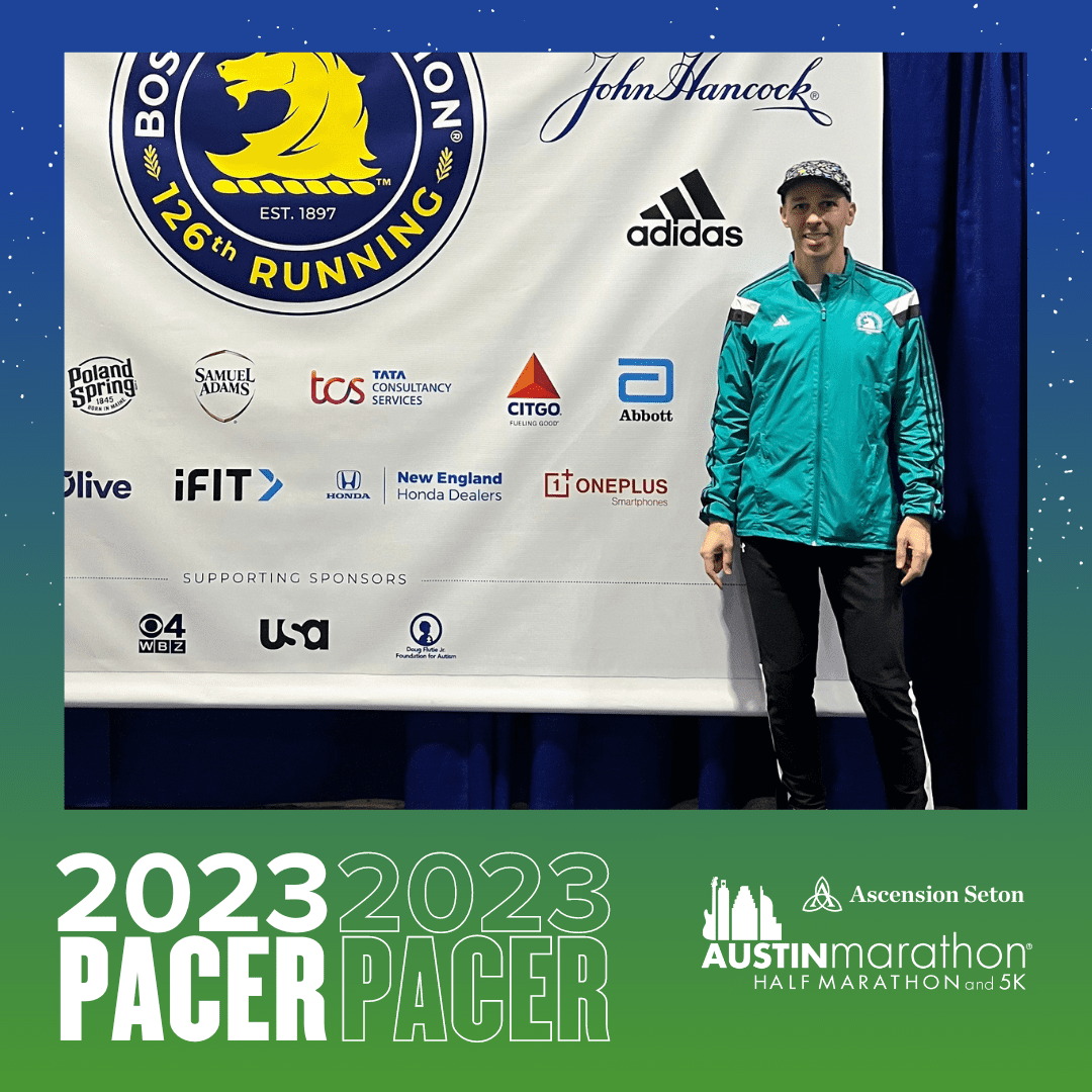 Austin Marathon pacer standing by sponsor banner Austin Marathon pacer standing by sponsor banner