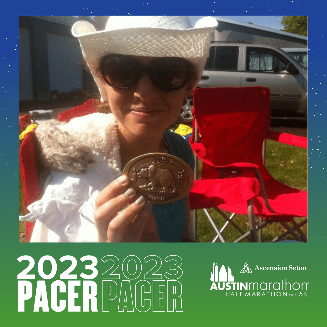 Smiling person wearing cowboy hat holding medal Smiling person wearing cowboy hat holding medal