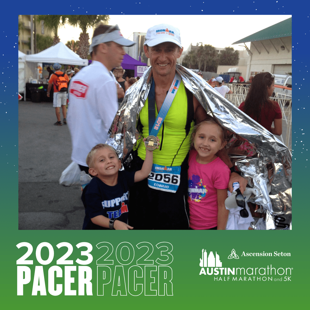 Smiling marathon finisher with children and medal Smiling marathon finisher with children and medal