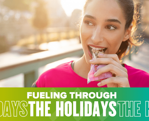 Young woman biting into granola bar outdoors
