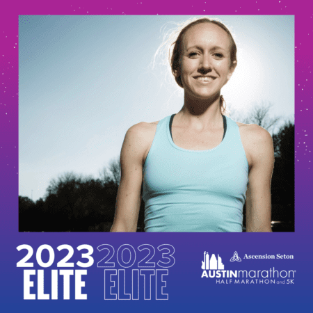 Smiling runner beside 2023 Austin Marathon Elite banner