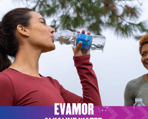 Woman drinking Evamor alkaline water outdoors