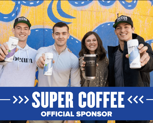Group holding Super Coffee cans and cup