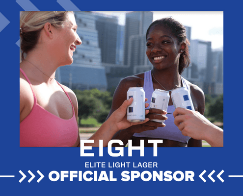 Three women clinking light lager cans outdoors