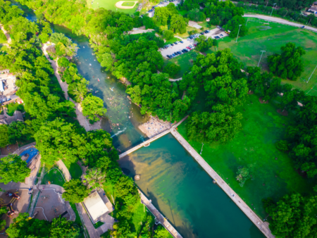 Aerial view of park with river and bridge Aerial view of park with river and bridge