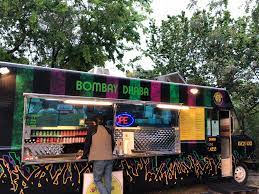 Bombay Dhaba food truck with customer Bombay Dhaba food truck with customer