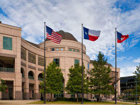 Building with United States and Texas flags Building with United States and Texas flags