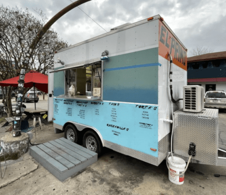 Light blue Mexican food truck with serving window Light blue Mexican food truck with serving window