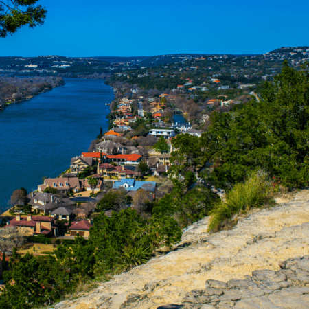 Riverfront neighborhood along tree-lined hillside Riverfront neighborhood along tree-lined hillside