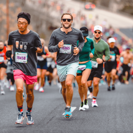 Group of runners competing in outdoor marathon