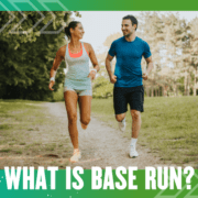 Smiling couple running on park trail