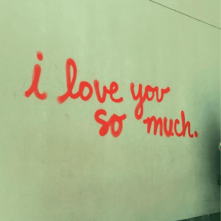 Red graffiti reading "I love you so much Red graffiti reading "I love you so much