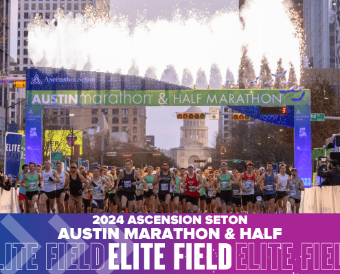 Runners starting Austin Marathon with fireworks overhead