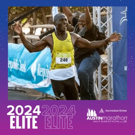 Smiling runner crossing Austin Marathon finish line