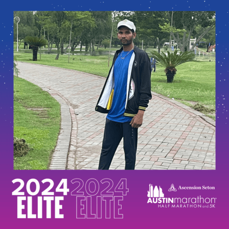 Athlete standing on park path with marathon frame